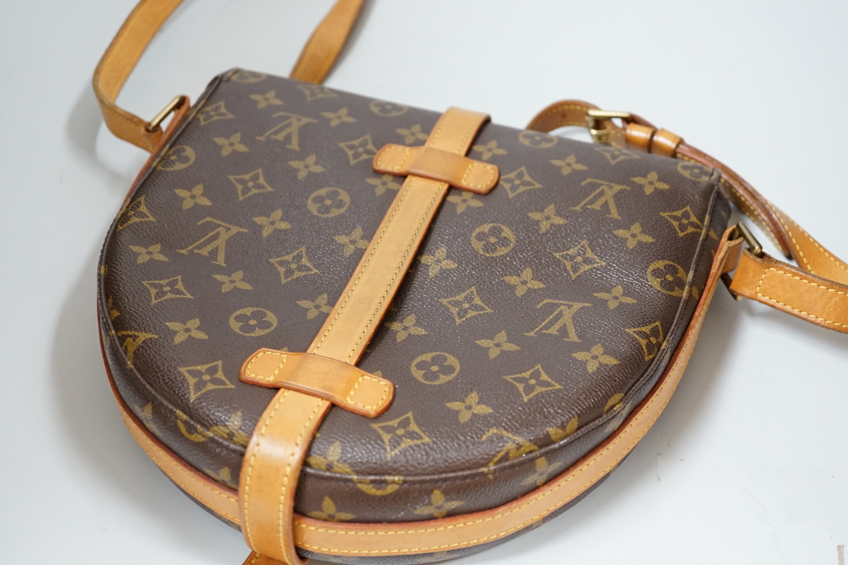 A Louis Vuitton lady’s handbag, horseshoe shaped, 28cm wide